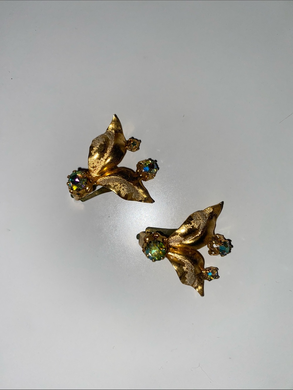 Gold Tone Leaf Crystal Clip One Earrings - Green Aurora